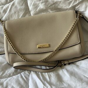 Cream Kate Spade cross body purse with removable strap and gold chain detailing